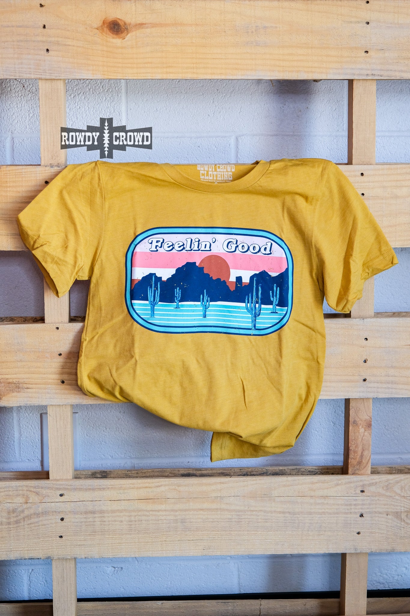 western apparel, western graphic tee, graphic western tees, wholesale clothing, western wholesale, women's western graphic tees, wholesale clothing and jewelry, western boutique clothing, western women's graphic tee, bright rodeo graphic tee, cacti graphic tee, cactus, bright graphic tee, colorful graphic tee, desert scene graphic tee, colorful western graphic tee desert scene tee, feelin' good tee
